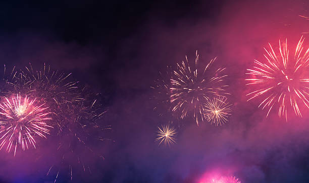 istock Red fireworks bloom on the dark sky 2214801086