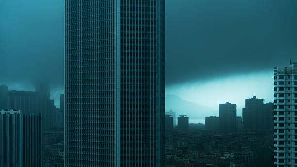 istock City buildings covered by dark storm clouds 2214801154