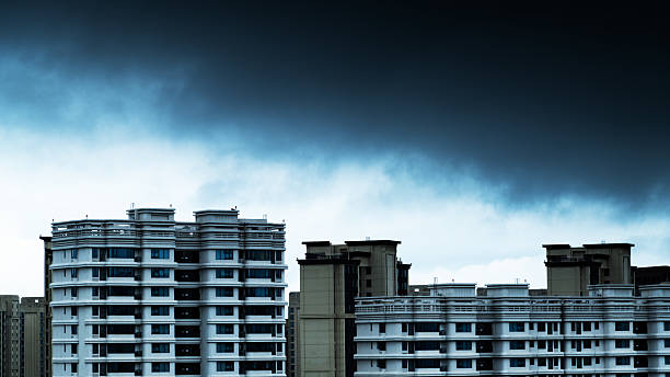 City buildings covered by dark storm clouds