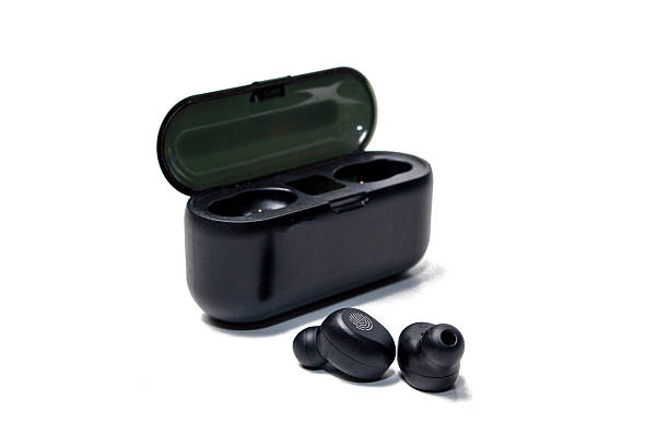 istock High angle view of the black wireless stereo earbuds and charging case 2214805875
