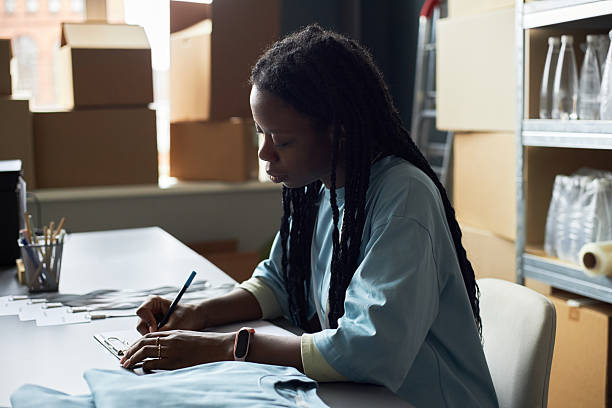 istock Young Professional Woman Working in Office Storage Room 2214806429