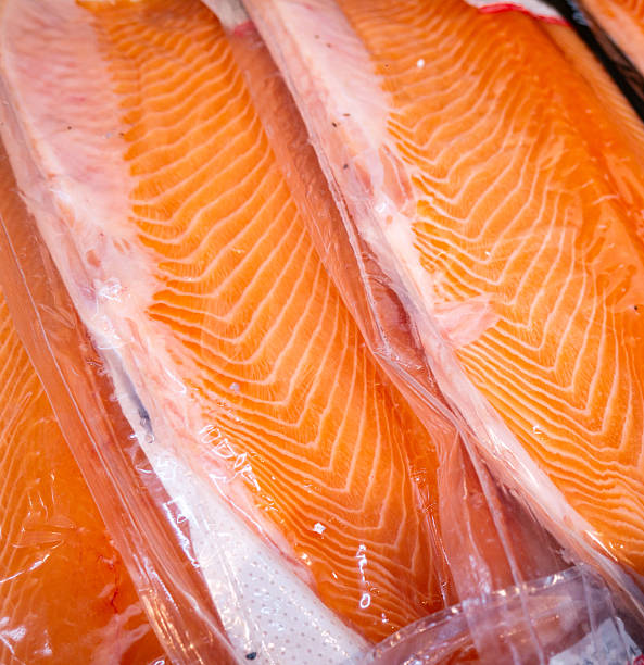 istock Salmon fillet in a vacuum package plastic bag. 2214808152