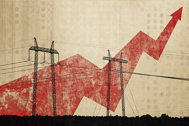 istock Electricity pylons and power lines with a red arrow pointing upwards, symbolizing increasing energy prices or growing electricity consumption 2214809953