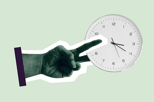 istock Hand cutting clock, symbol of saving time. Efficient use of time metaphor 2214813093