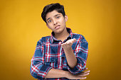 young-teenager-boy-wearing-plaid-shirt-isolated-on-yellow-background-stock-photo.jpg?b=1&s=170x170&k=20&c=amdyYRWo7Kb0k27RbtAdmUTK4NjgIJhUI322izesX_4=