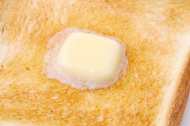 istock sliced toasted bread with melted butte 2214814136