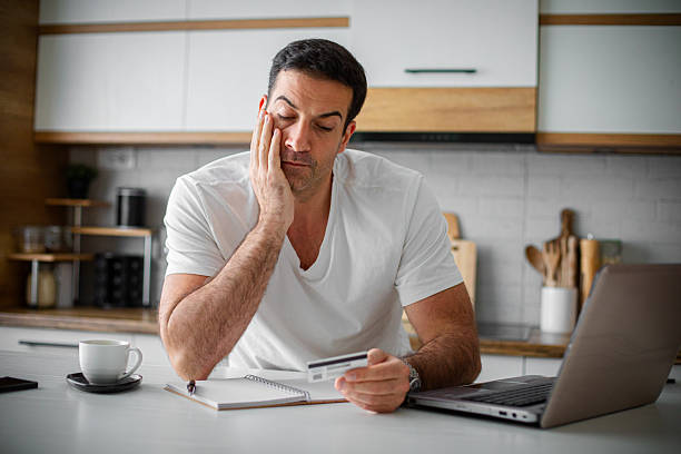 istock Man having financial problems with credit card debt mortgage 2214814972