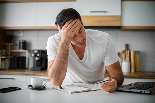 istock Man having financial problems with credit card debt mortgage 2214814996