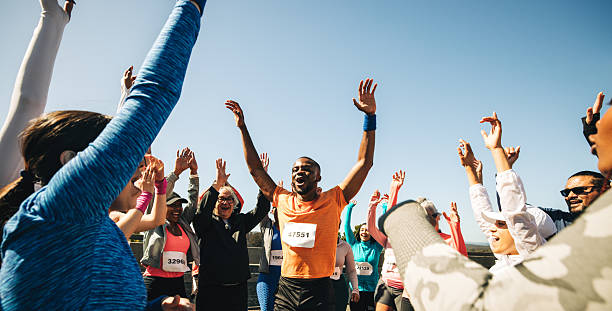 istock Friends celebrating after a successful group running race event 2214816161