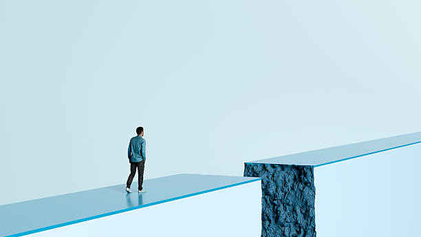 istock Man Standing at the Edge of a Broken Path - Life Challenges, Difficult Decisions, Uncertainty, and Overcoming Obstacles, 3D Render 2214816281