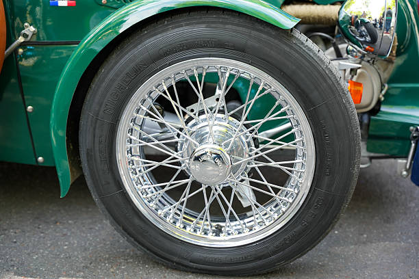 Germany Berlin May 11, 2025. Tire with spoked rim close-up. Detailed shot of a classic spoked wheel with a shiny chrome rim and Michelin tires. The combination of retro design and well-maintained condition conveys vintage charm and technical precision.