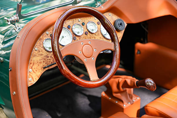 Germany Berlin May 11, 2025. Interior with wooden steering wheel and instruments. Elegant interior of a vintage car with a handcrafted wooden steering wheel and leather trim. The classic round instruments and the elegant dashboard create a luxurious vintage atmosphere.