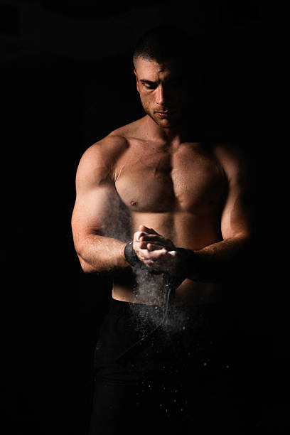 istock the athlete puts chalk on his hands 2214821709