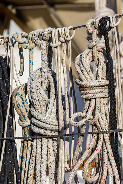 istock Closeup of Nautical Ropes Neatly Coiled on a Ship Deck 2214821872