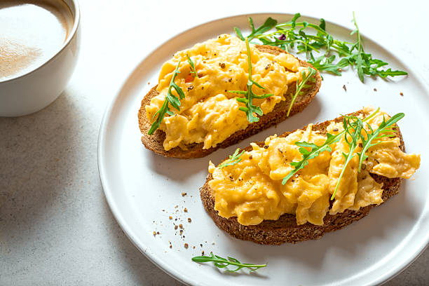 istock Scrambled Eggs sandwiches and cup of coffee for breakfast 2214821948