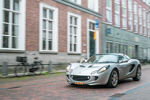 Lotus Elise compact sports car driving on the street in Zwolle during a charity event.