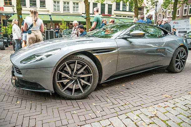 Aston Martin DB11 sports car driving on the street in Zwolle during a charity event.