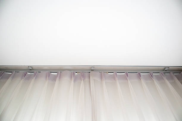 Bright interior with floor-to-ceiling soft white curtains and natural light. Ideal for architecture, home design, and lifestyle content with minimalist aesthetic.
