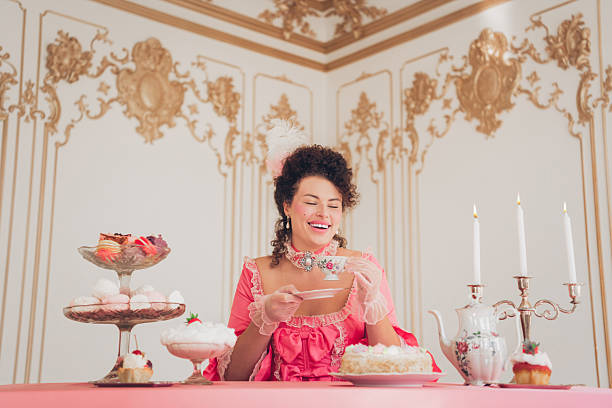 istock Elegant woman enjoying tea time in a luxurious baroque setting 2214825206