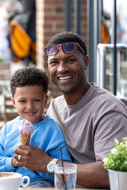 istock Father & Son Portrait With Ice Cream 2214826487