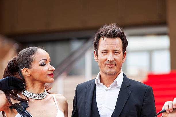istock Celebrity couple on red carpet in Cannes 2214828472