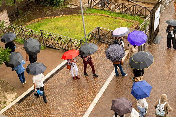 High angle view of tourist with umbrellas exploring local landmark
