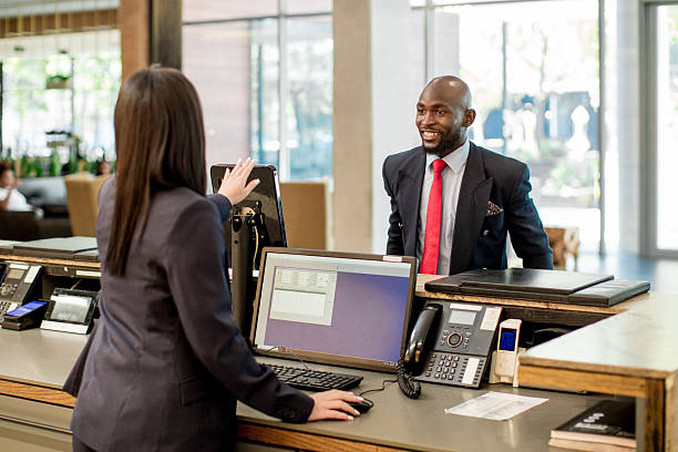 istock Businessman checking-in at the Hotel reception desk 2214828826