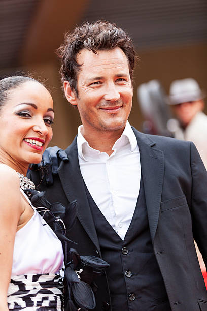 istock Celebrity couple on red carpet in Cannes 2214830359