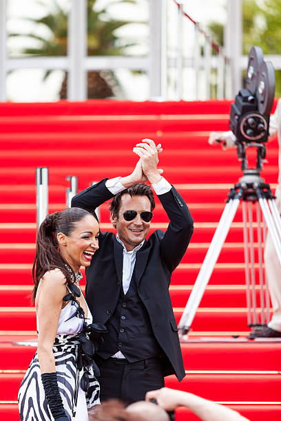 istock Celebrity couple on red carpet in Cannes 2214830674