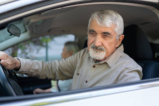 istock Senior Man Driving His Car 2214834637