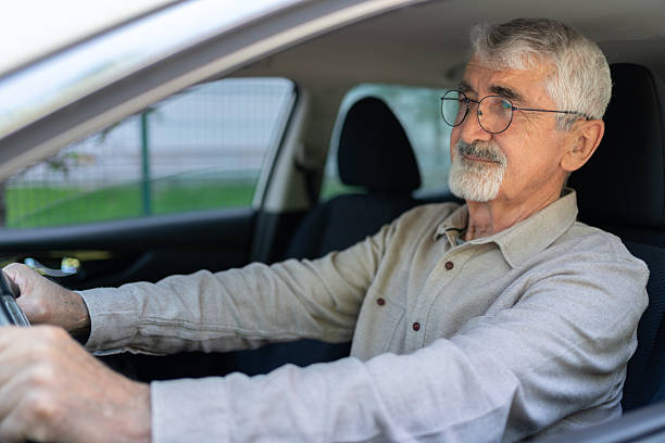 istock Senior Man Driving His Car 2214834740