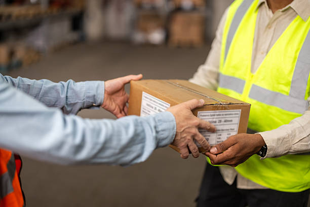 istock A pair of workers is sorting packages at the warehouse 2214835012