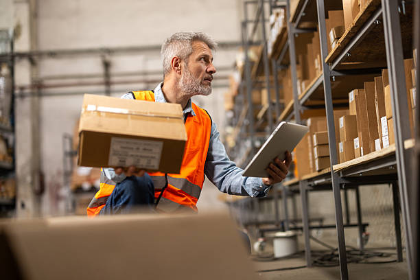 istock A logistics worker is positioning packed goods in their designated storage spots 2214835013
