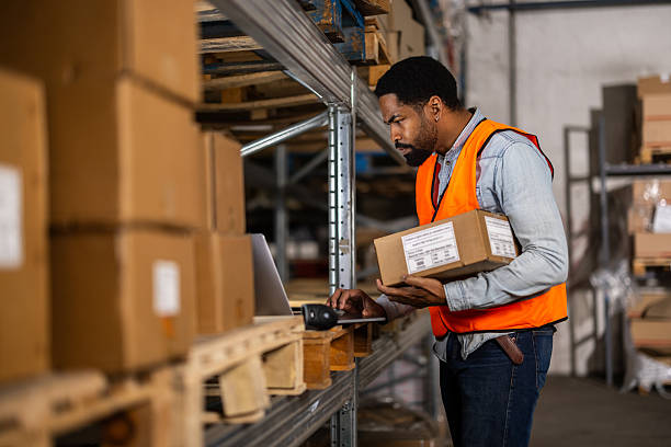 istock An employee checks inventory storage by scanning item barcodes 2214835044