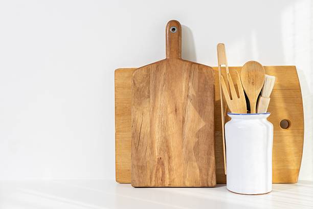 istock Wooden kitchen utensils on white background. Cooking background with copy space 2214843045