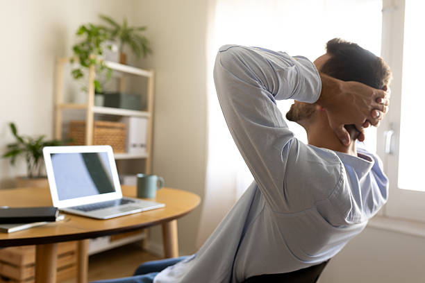 istock Businessman relaxing at home office after work 2214843656
