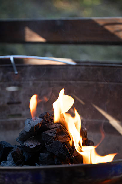 istock Charcoal burning in outdoor grill with visible flames 2214847140