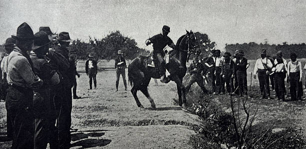 istock Antique illustration - War of 1898 - War with Spain - scene in a cavalry camp - training a refractory horse - army 2214847330