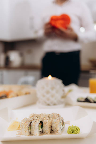 Intimate Romantic Dinner With Sushi Platter and Warm Candlelight Ambiance