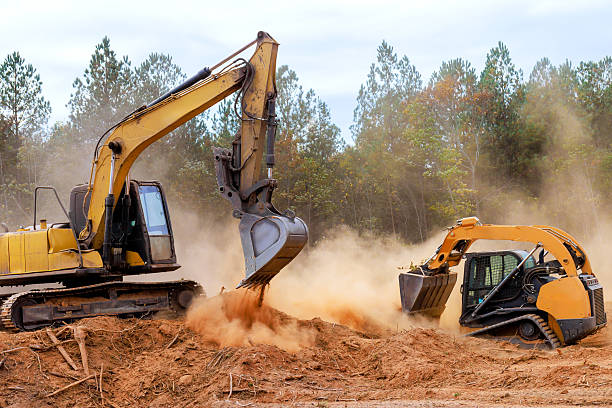 istock Heavy machinery operates on construction site to clear land for future development infrastructure projects 2214850378