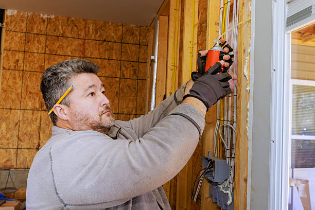 istock Skilled worker repairing electrical wiring in a residential construction site during daylight hours 2214850427