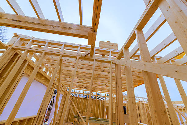 istock Construction of a wooden framework in a new building under clear sky during daytime 2214850431
