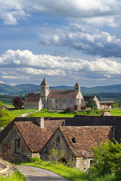 istock Romanesque church overlooking Sigy le Chatel in Bourgogne Franche Comte, France 2214850917