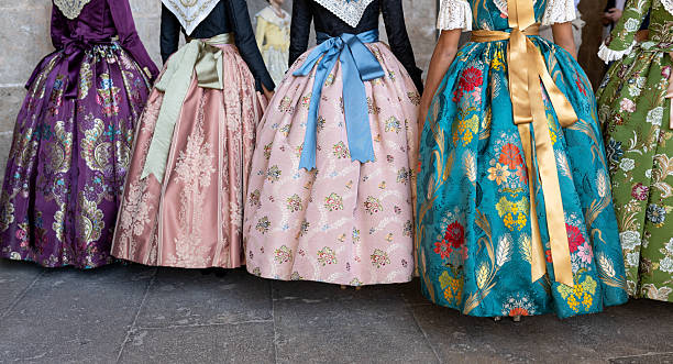 istock Unknown falleras dress from Valencia Fallas fest in a row at Spain. 2214851562