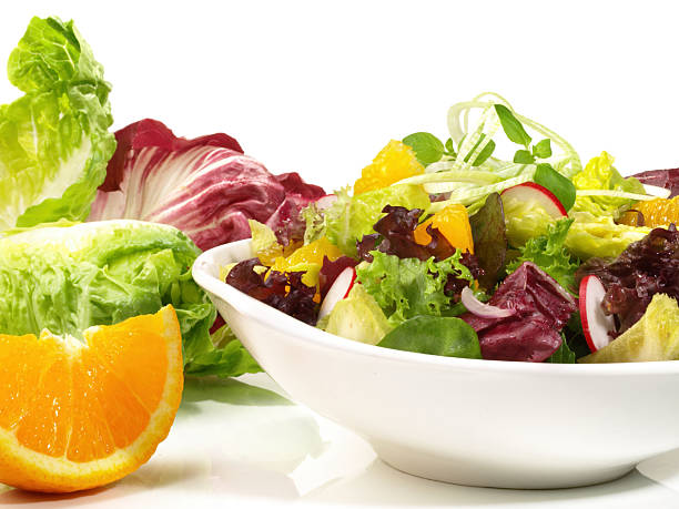 istock Fresh Mixed Salad with Orange isolated on white Background 2214853632