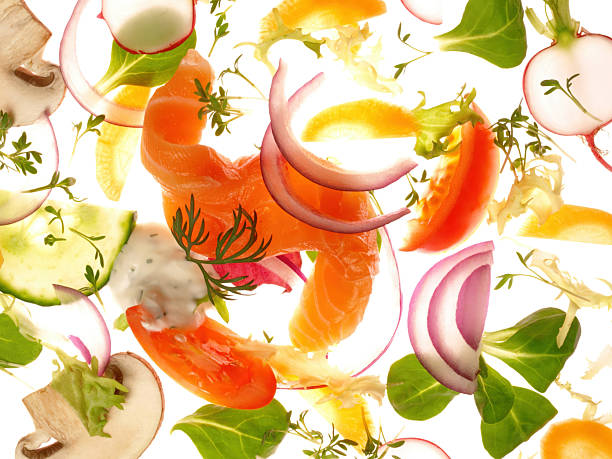 Fresh Mixed Salads with Salmon on a lighting white Background