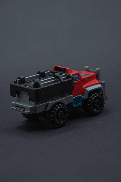 istock Toy fire truck is on a black surface. 2214854365