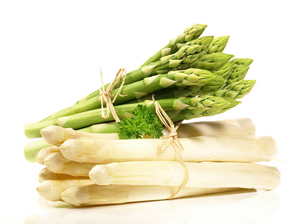 istock White and Green Asparagus isolated on white Background 2214854441