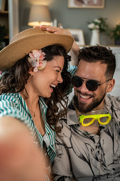 istock Happy couple taking a selfie while dreaming of summer vacation 2214861372