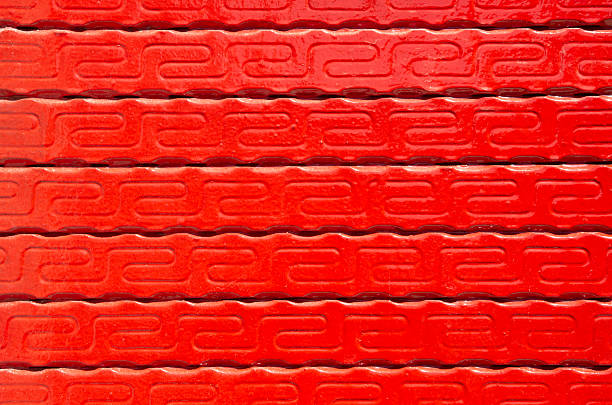Close-up texture of a red painted rough surface